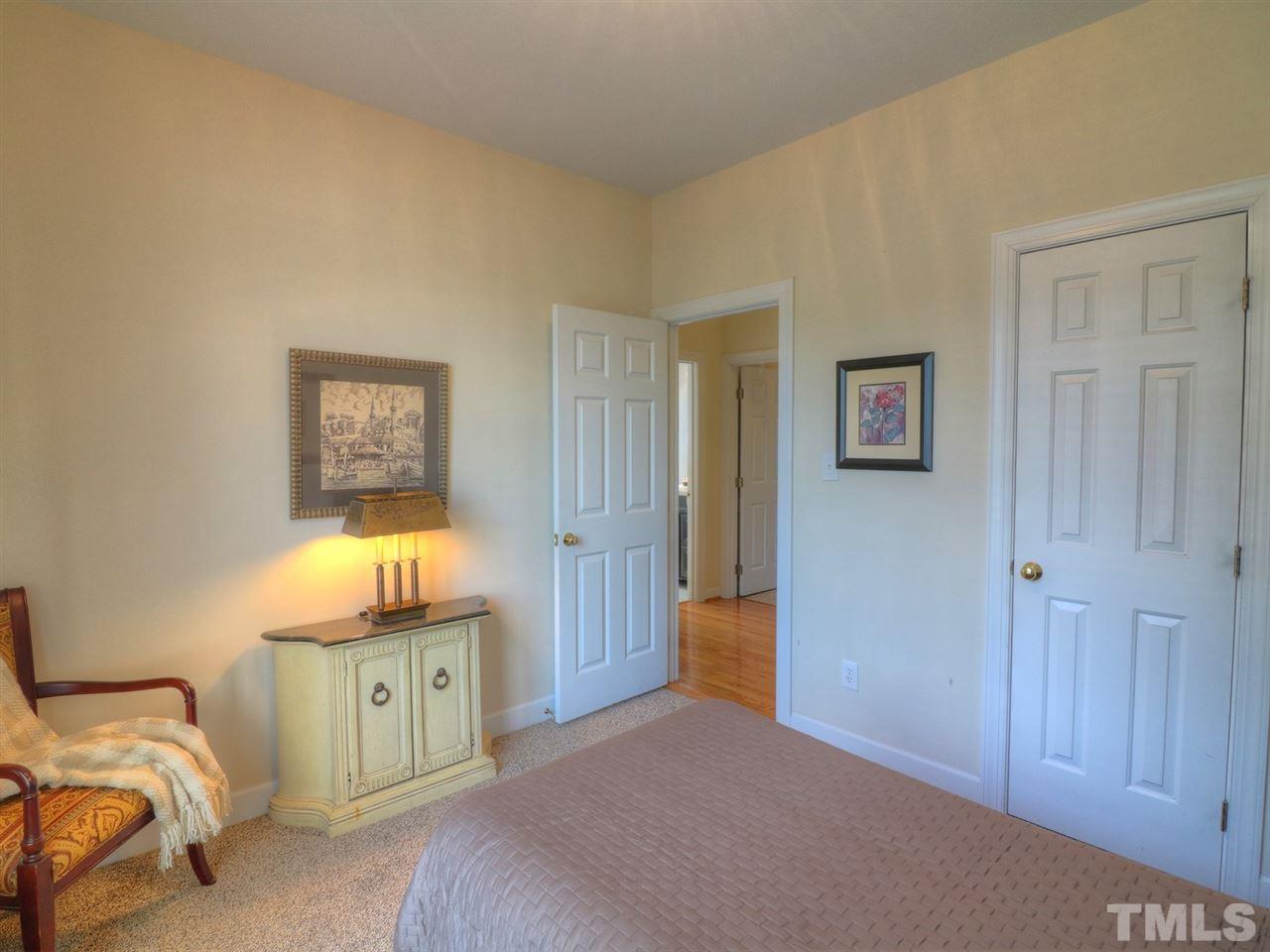 9304 Dawnshire Road Raleigh, NC 27615 - Photo 20 of 30 a bedroom with a bed and a window