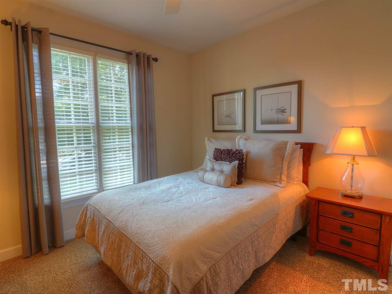 9304 Dawnshire Road Raleigh, NC 27615 - Photo 22 of 30 a bedroom with a bed and a window