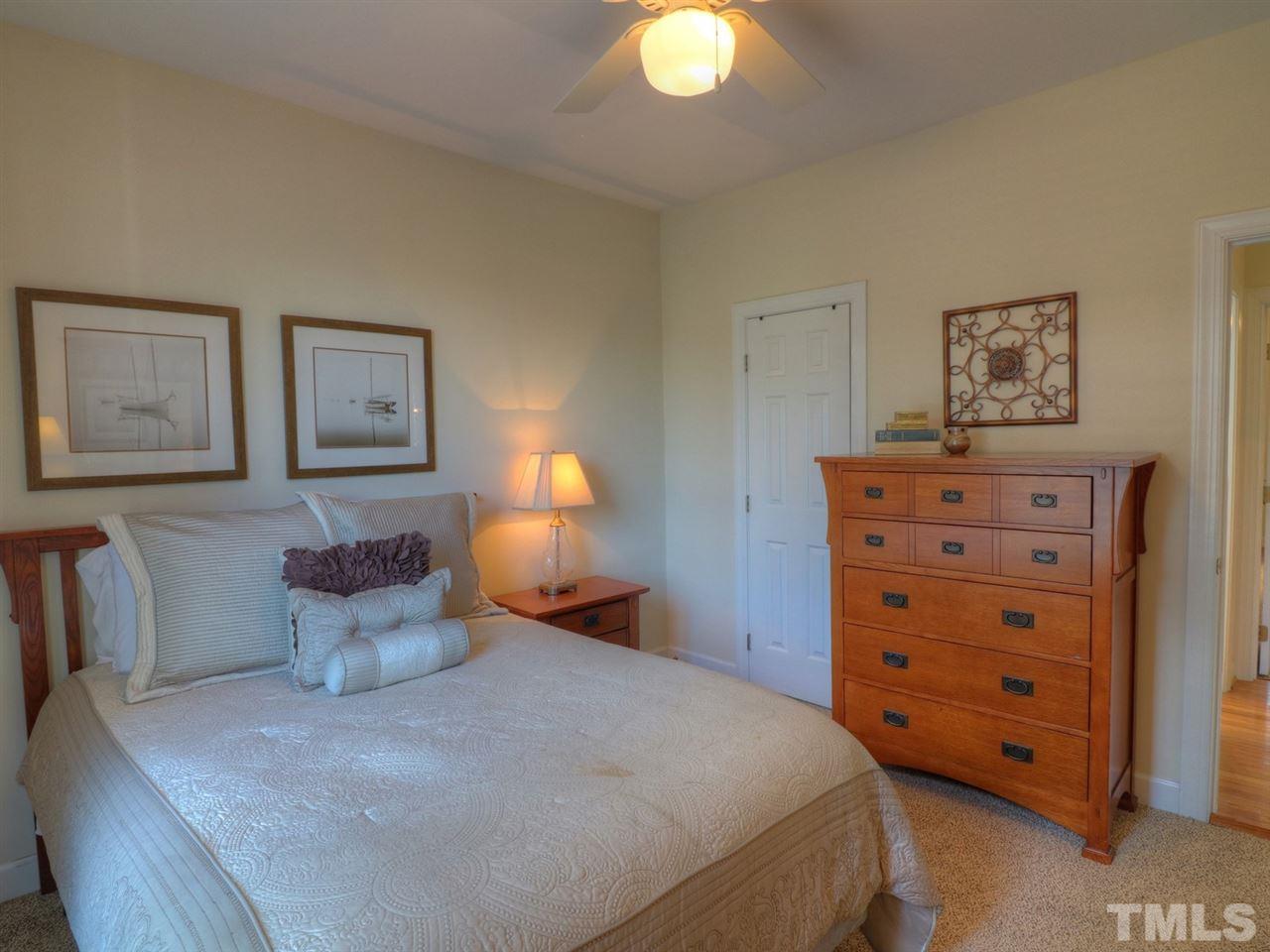 9304 Dawnshire Road Raleigh, NC 27615 - Photo 23 of 30 a bedroom with a bed and lamp