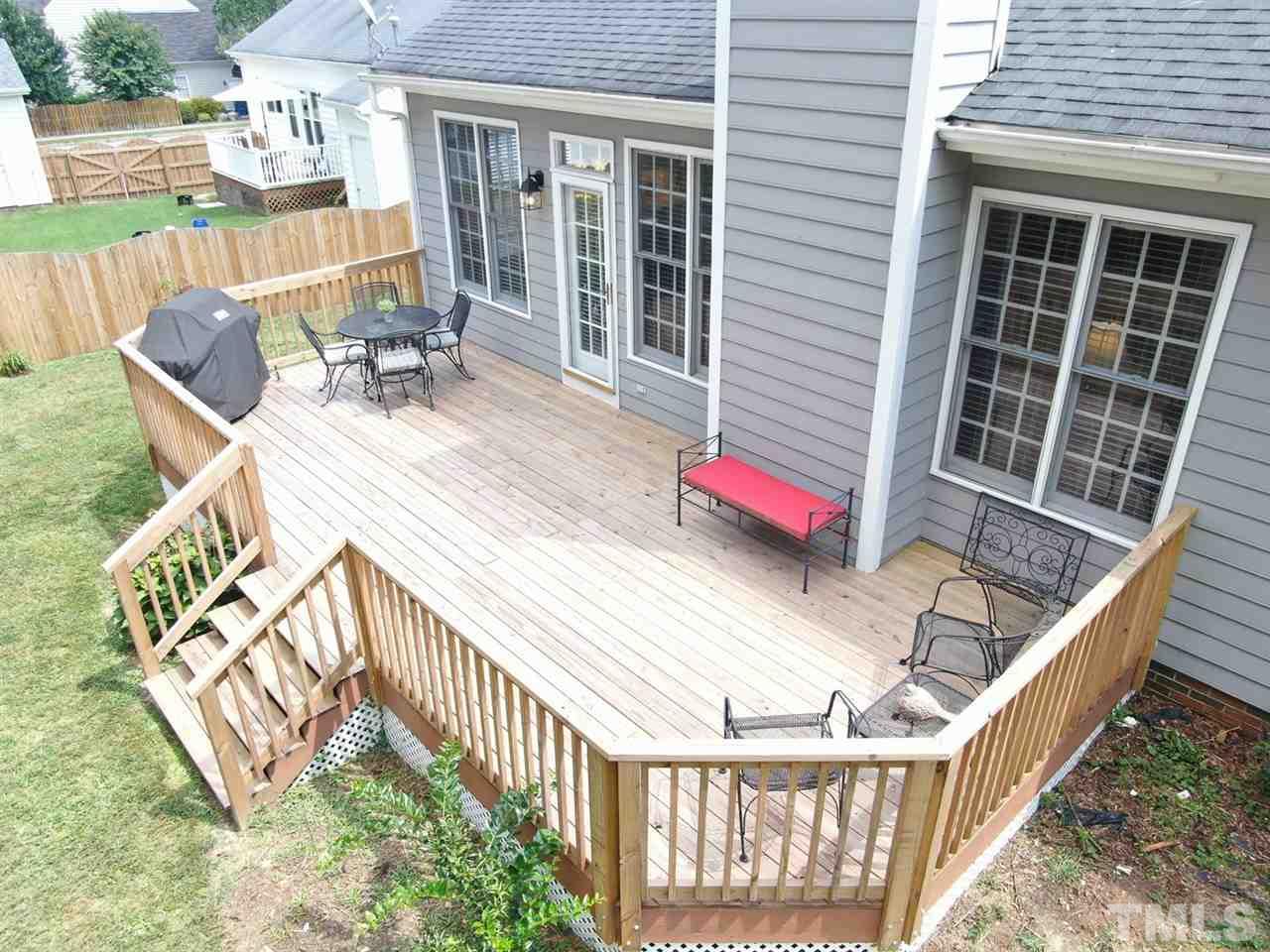 9304 Dawnshire Road Raleigh, NC 27615 - Photo 26 of 30 a view of balcony with wooden floor and seating space