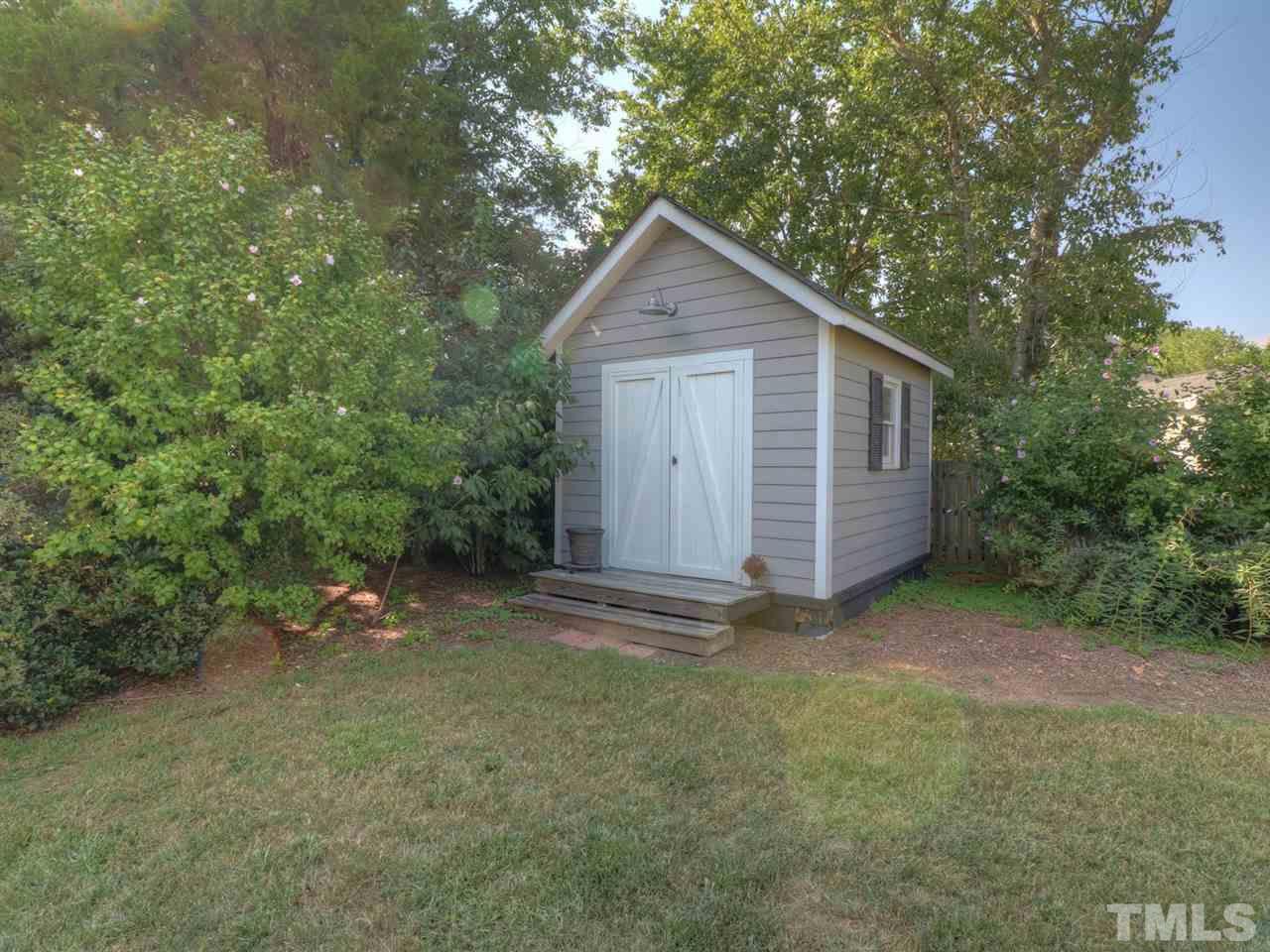9304 Dawnshire Road Raleigh, NC 27615 - Photo 27 of 30 a view of a house with a yard
