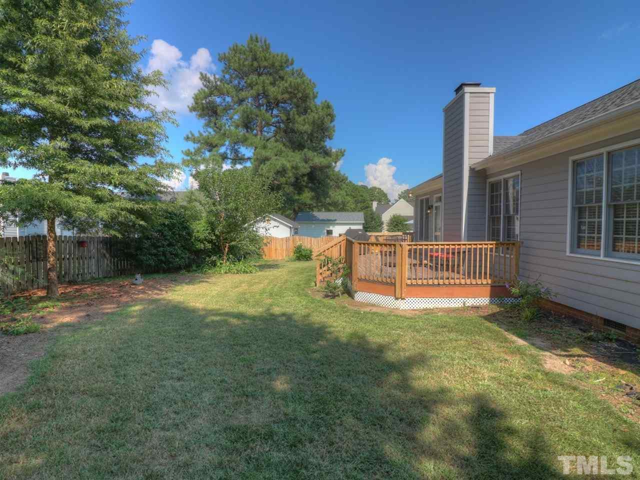 9304 Dawnshire Road Raleigh, NC 27615 - Photo 28 of 30 a view of a house with backyard and a tree