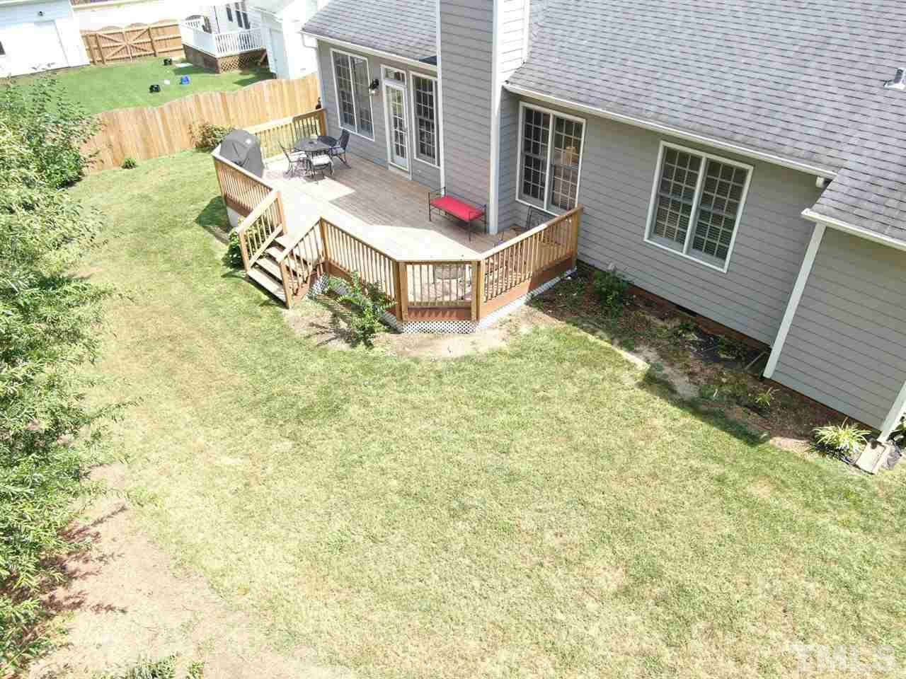 9304 Dawnshire Road Raleigh, NC 27615 - Photo 29 of 30 a view of house with backyard and seating area