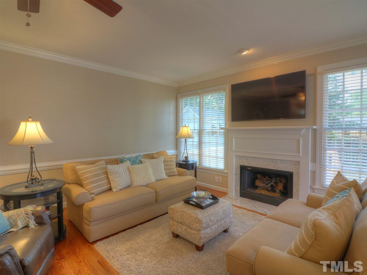 9304 Dawnshire Road Raleigh, NC 27615 - Photo 6 of 30 a living room with furniture and a fireplace