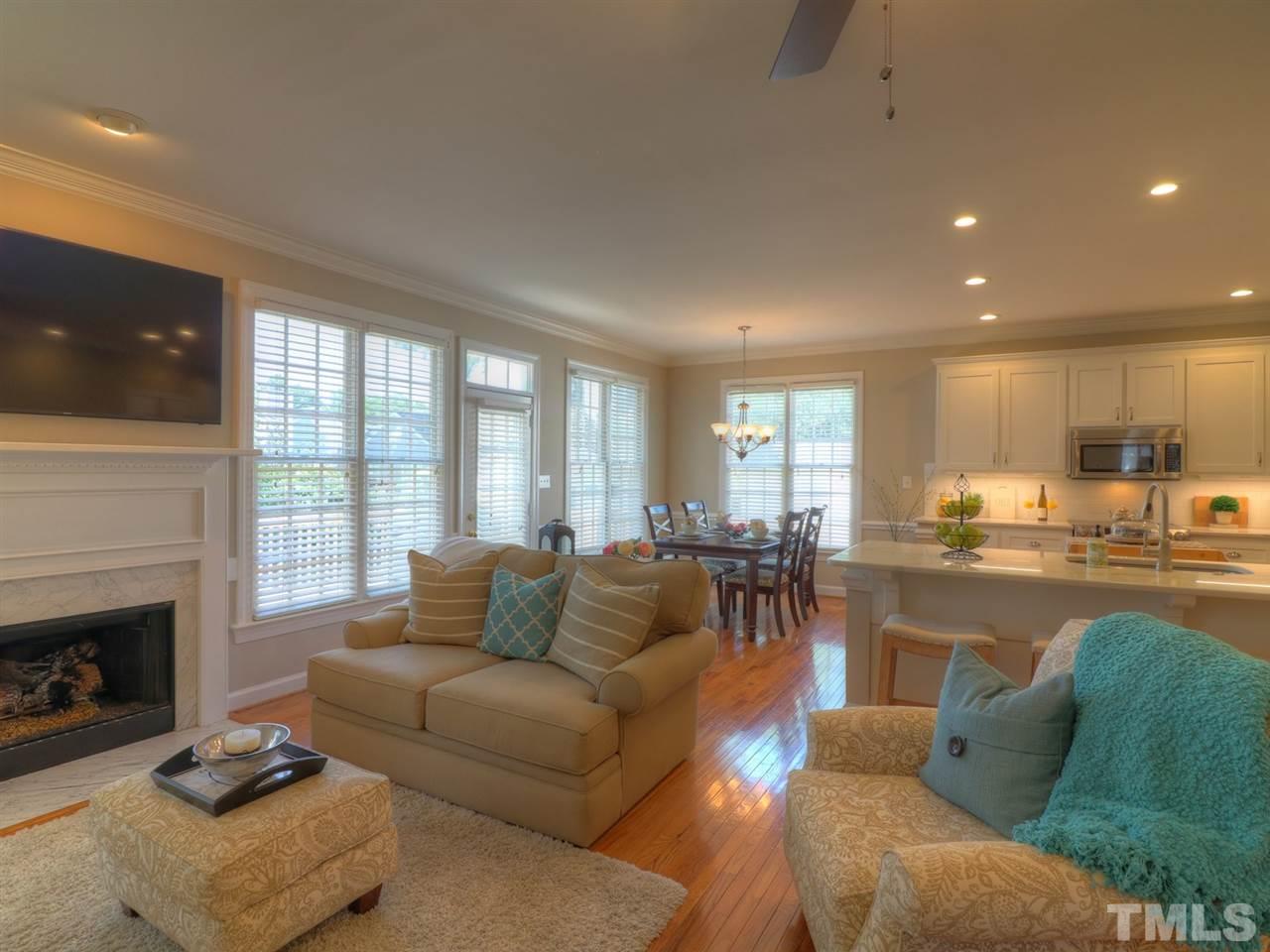 9304 Dawnshire Road Raleigh, NC 27615 - Photo 7 of 30 a living room with furniture and a fireplace