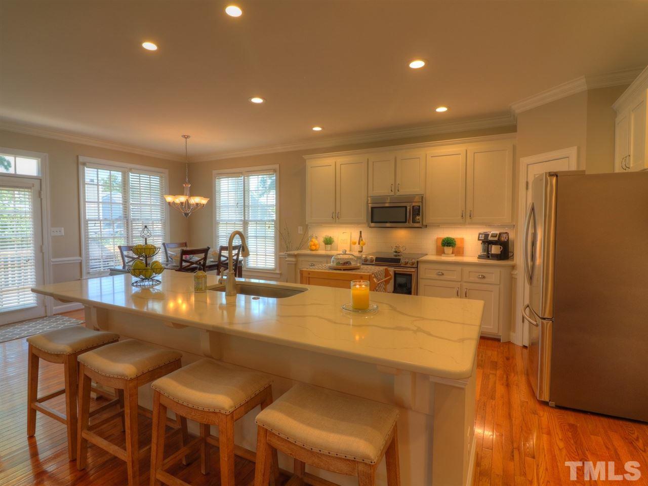9304 Dawnshire Road Raleigh, NC 27615 - Photo 10 of 30 a kitchen with counter top space a sink and appliances
