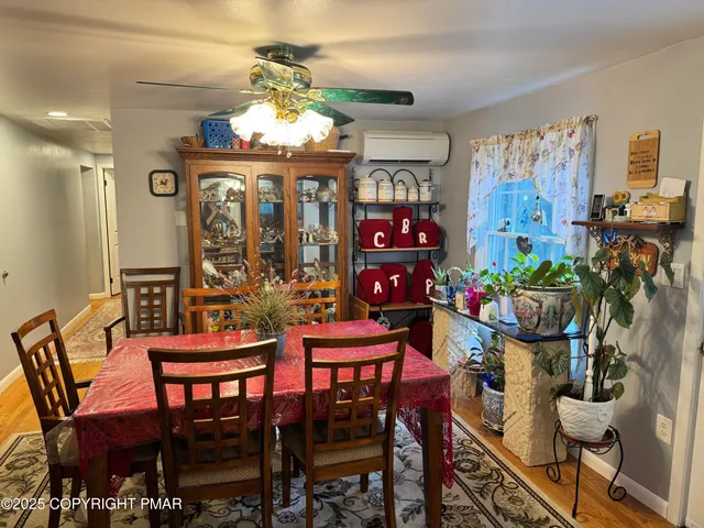 a view of a dining room with furniture window and outdoor view