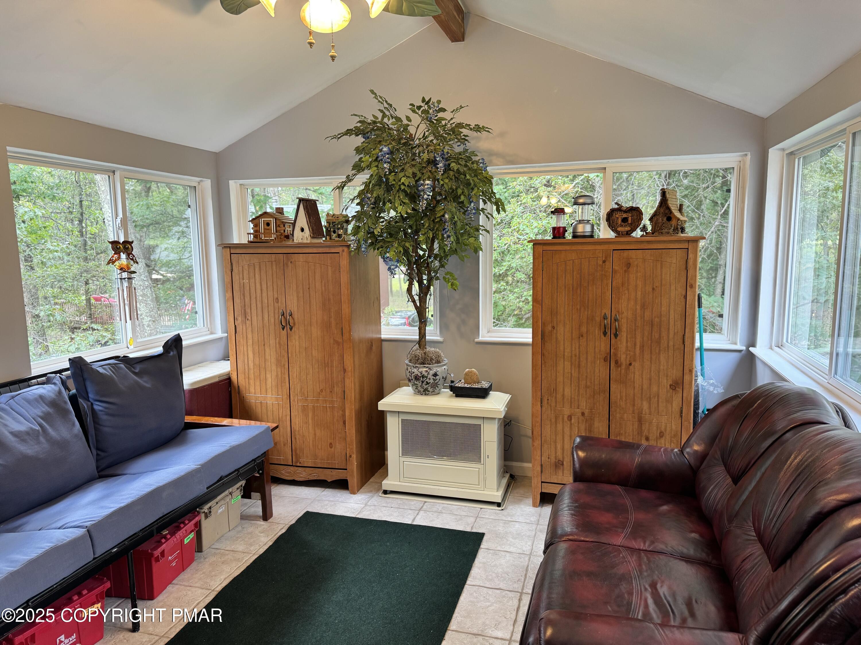 692 Watercrest Avenue Effort, PA 18330 - Photo 12 of 40 a living room with furniture and a window