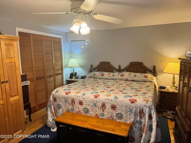 a bedroom with a bed and a mirror