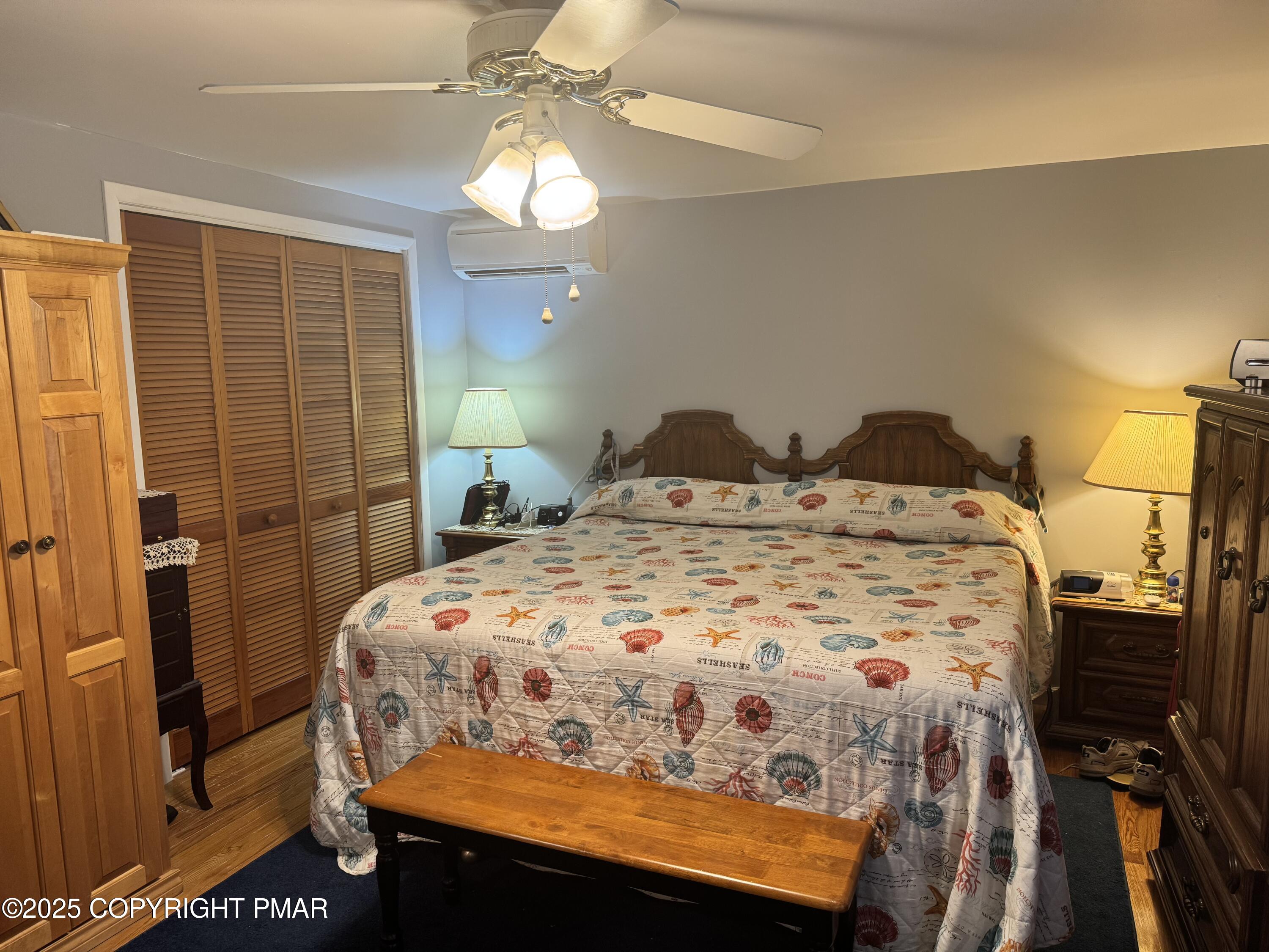 692 Watercrest Avenue Effort, PA 18330 - Photo 15 of 40 a bedroom with a bed and a mirror