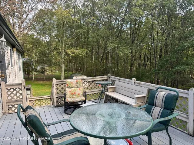 a view of a patio with couple of chairs