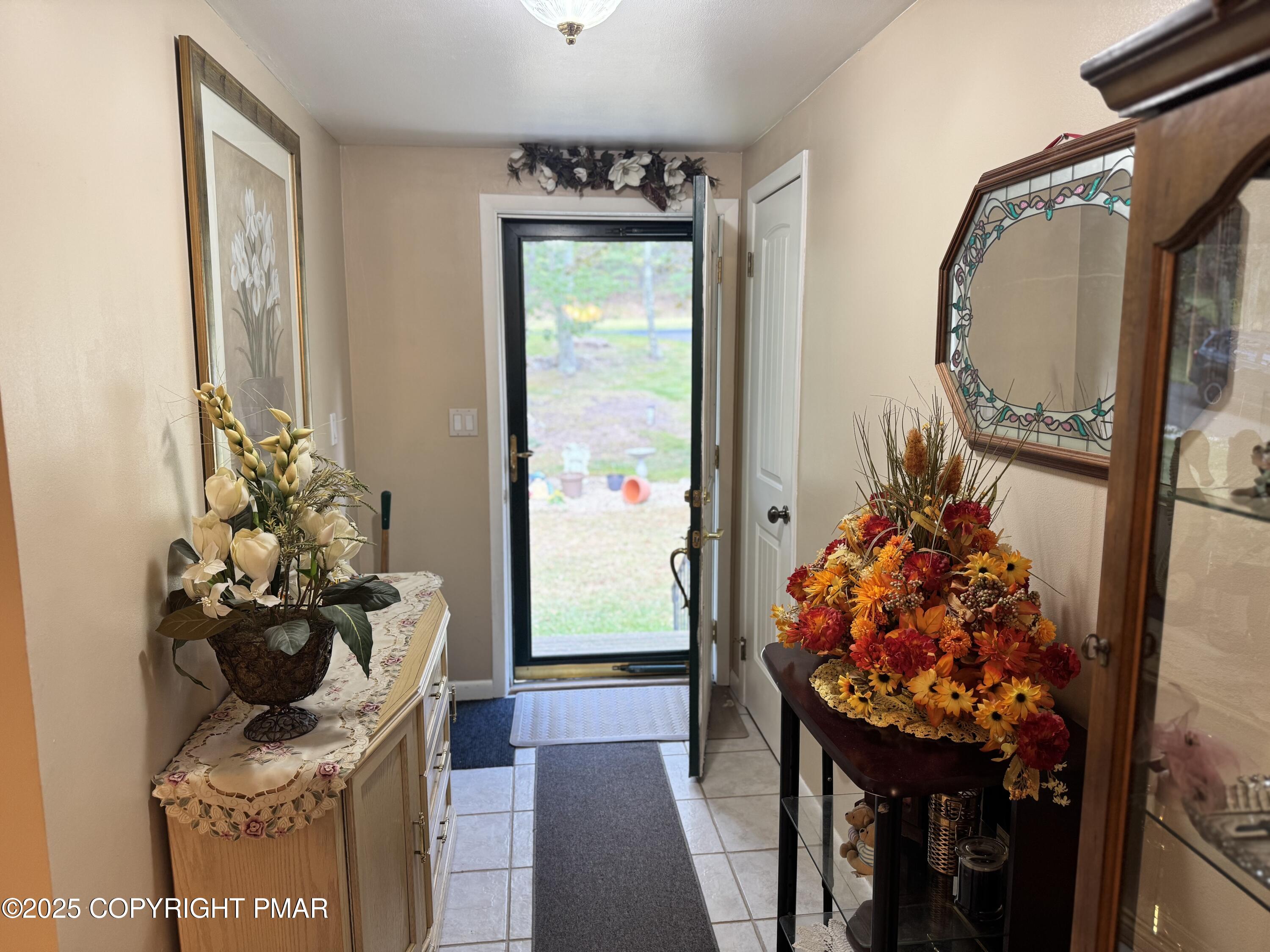 692 Watercrest Avenue Effort, PA 18330 - Photo 3 of 40 a room with painting on the wall and a mirror