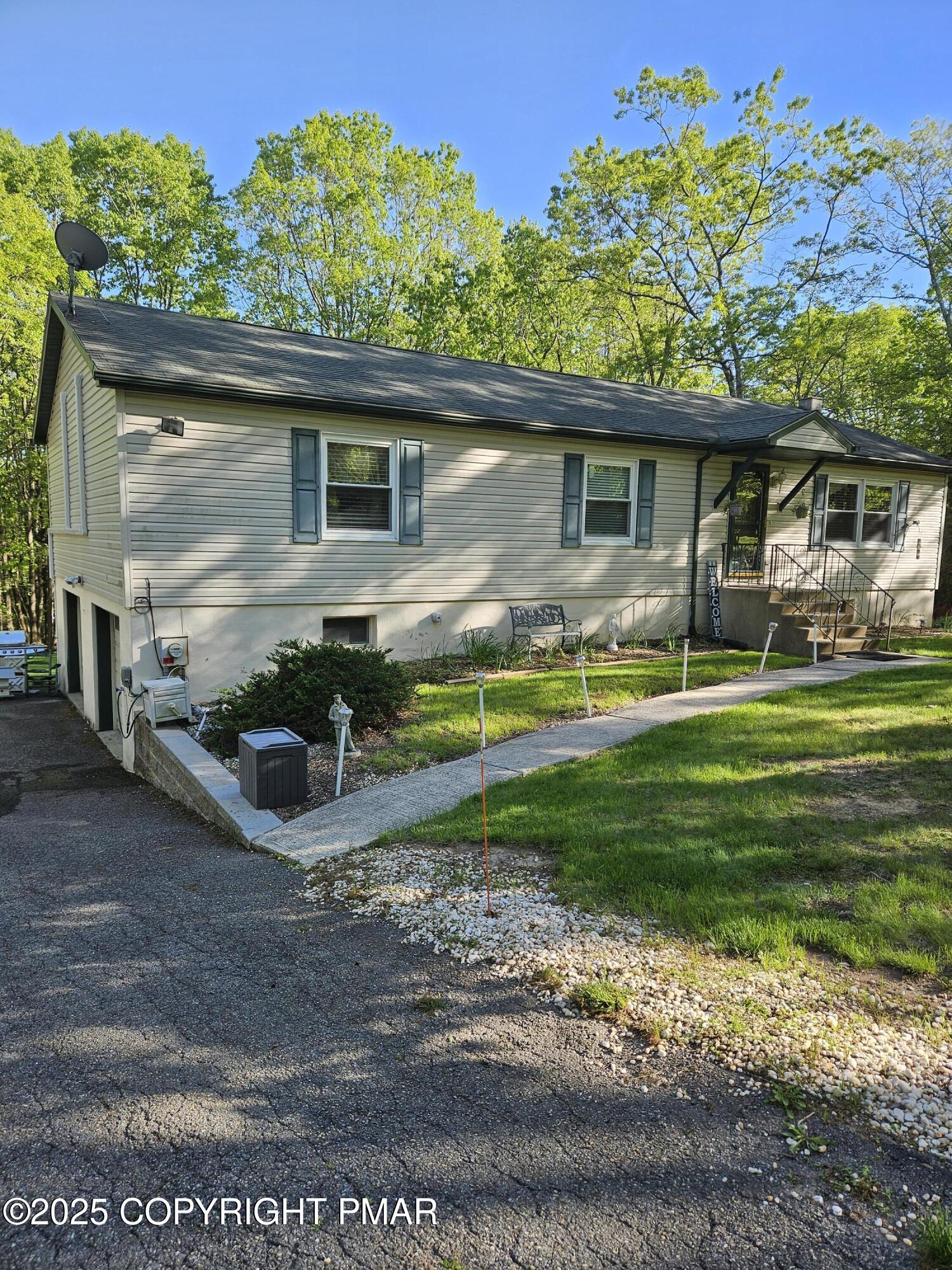 692 Watercrest Avenue Effort, PA 18330 - Photo 32 of 40 a front view of a house with a yard