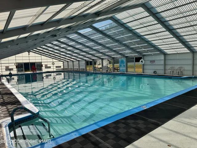 a view of a swimming pool with a patio