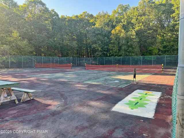 a view of swimming pool with a yard