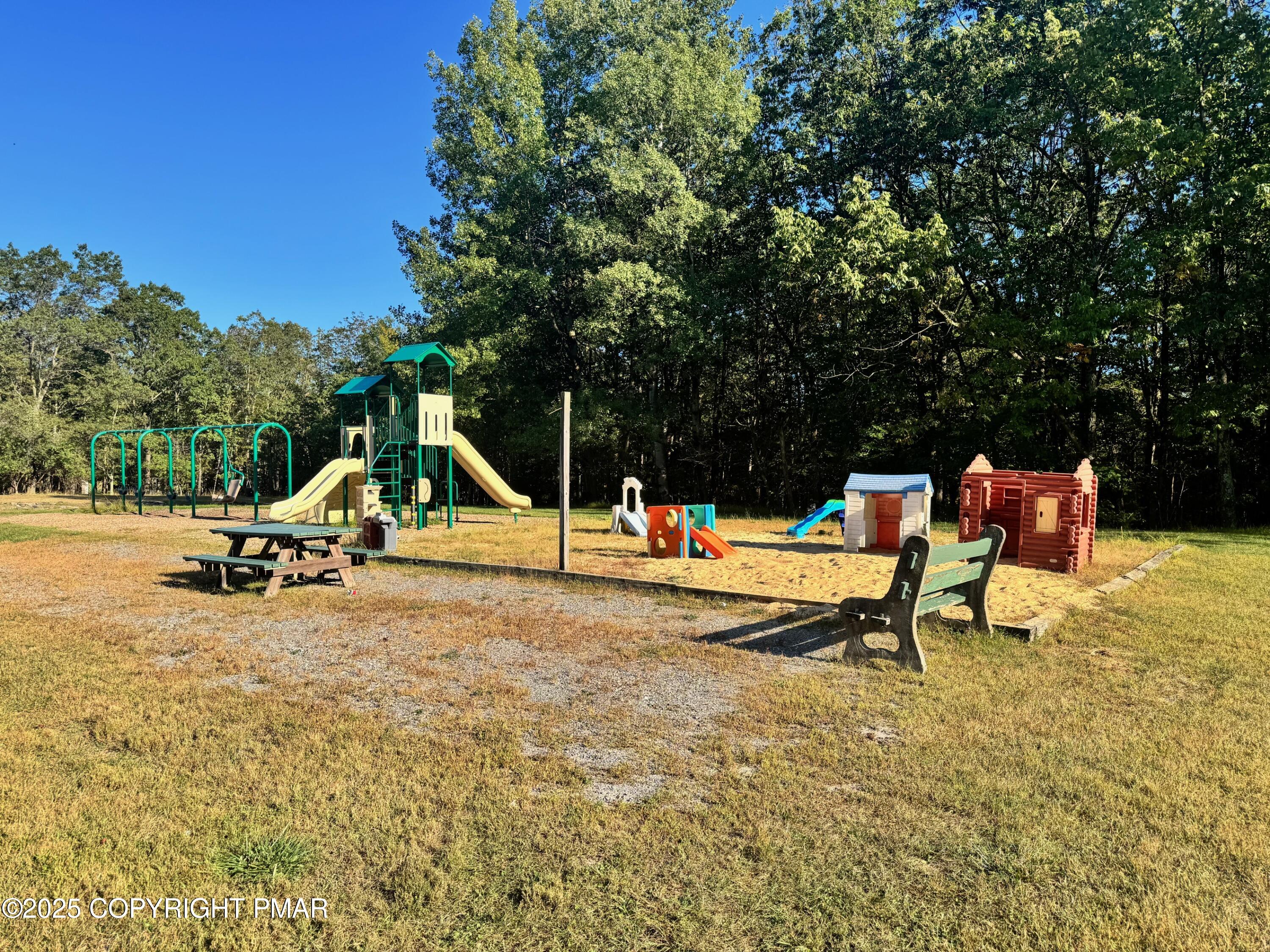 692 Watercrest Avenue Effort, PA 18330 - Photo 39 of 40 a park view with a bench and trees