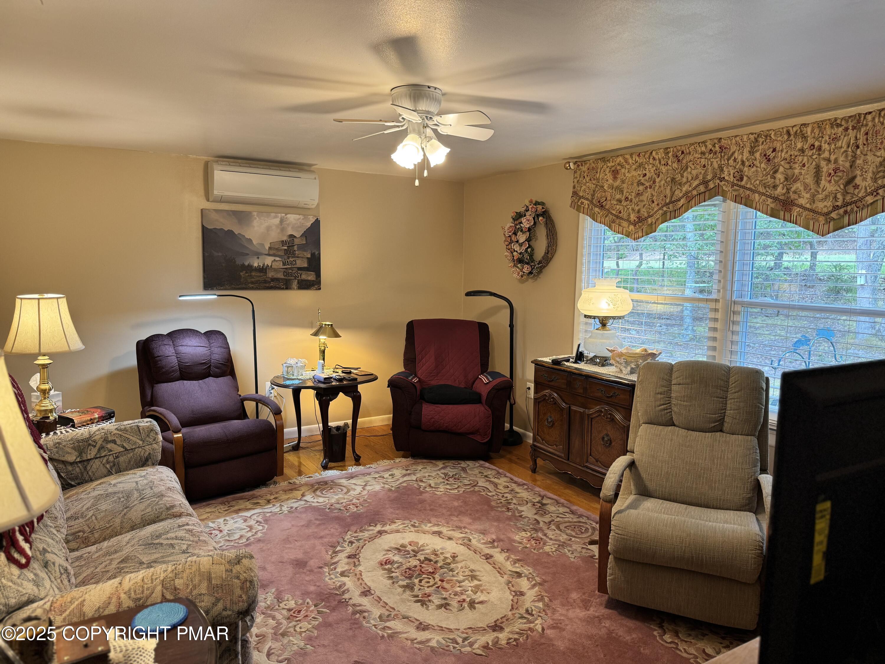 692 Watercrest Avenue Effort, PA 18330 - Photo 4 of 40 a living room with furniture and a large window
