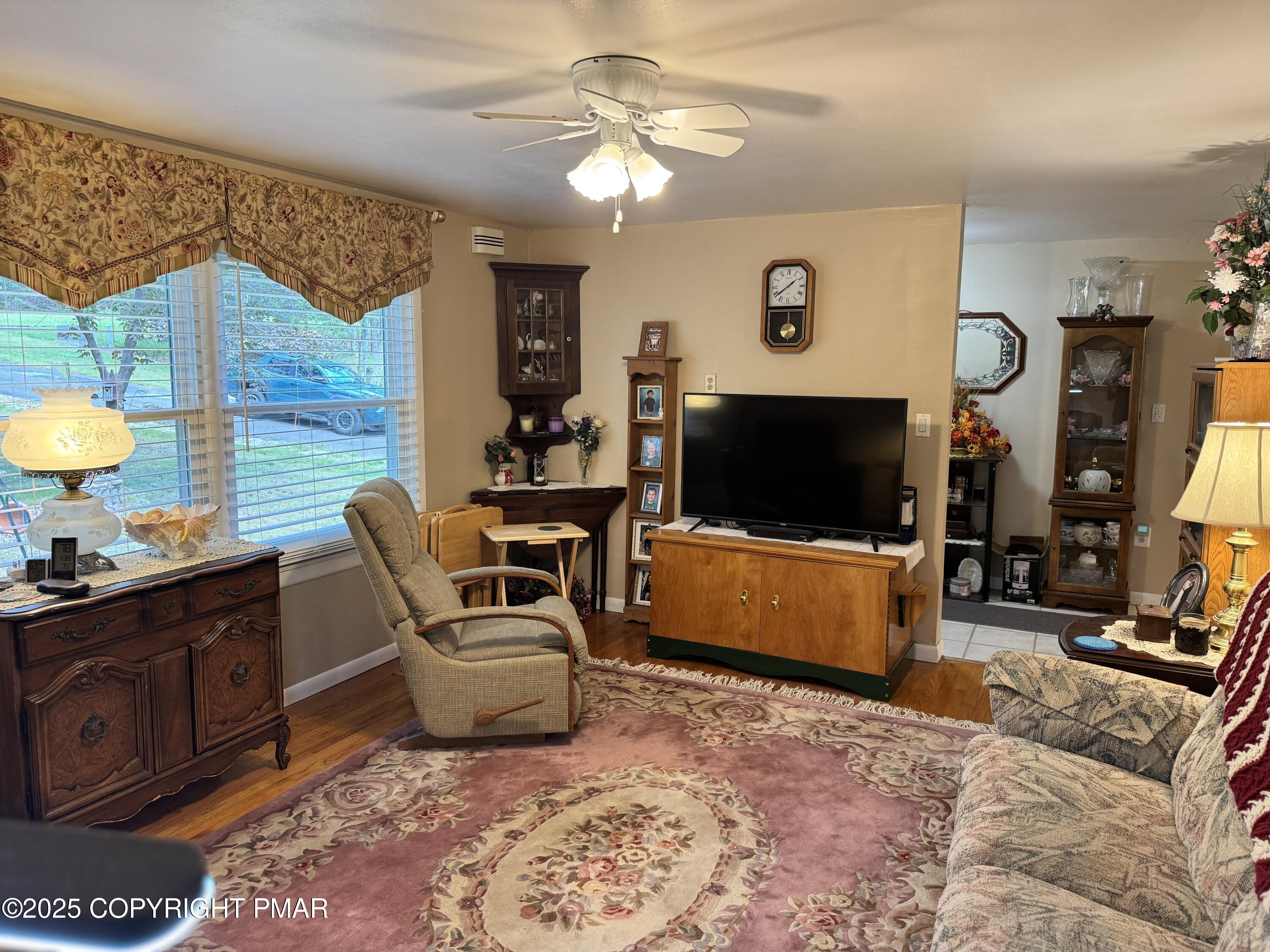 692 Watercrest Avenue Effort, PA 18330 - Photo 5 of 40 a living room with furniture and a flat screen tv