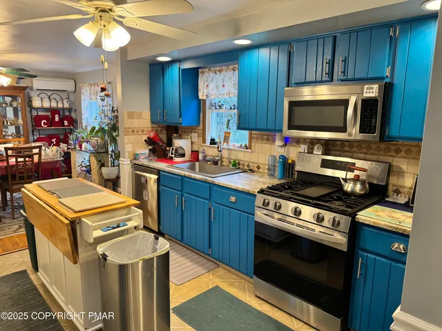 a kitchen with a stove and a microwave