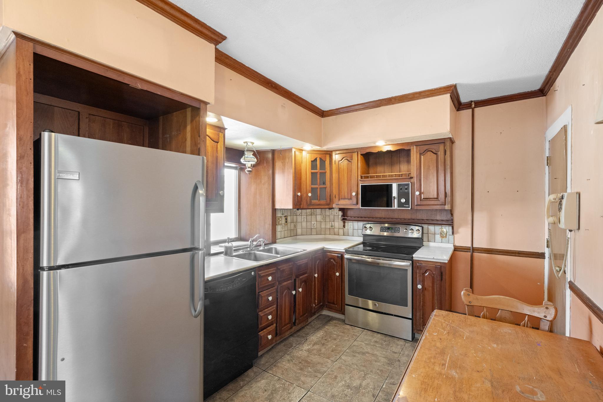 458 Renfrew Avenue Ambler, PA 19002 - Photo 21 of 31 a kitchen with stainless steel appliances granite countertop a refrigerator and a sink