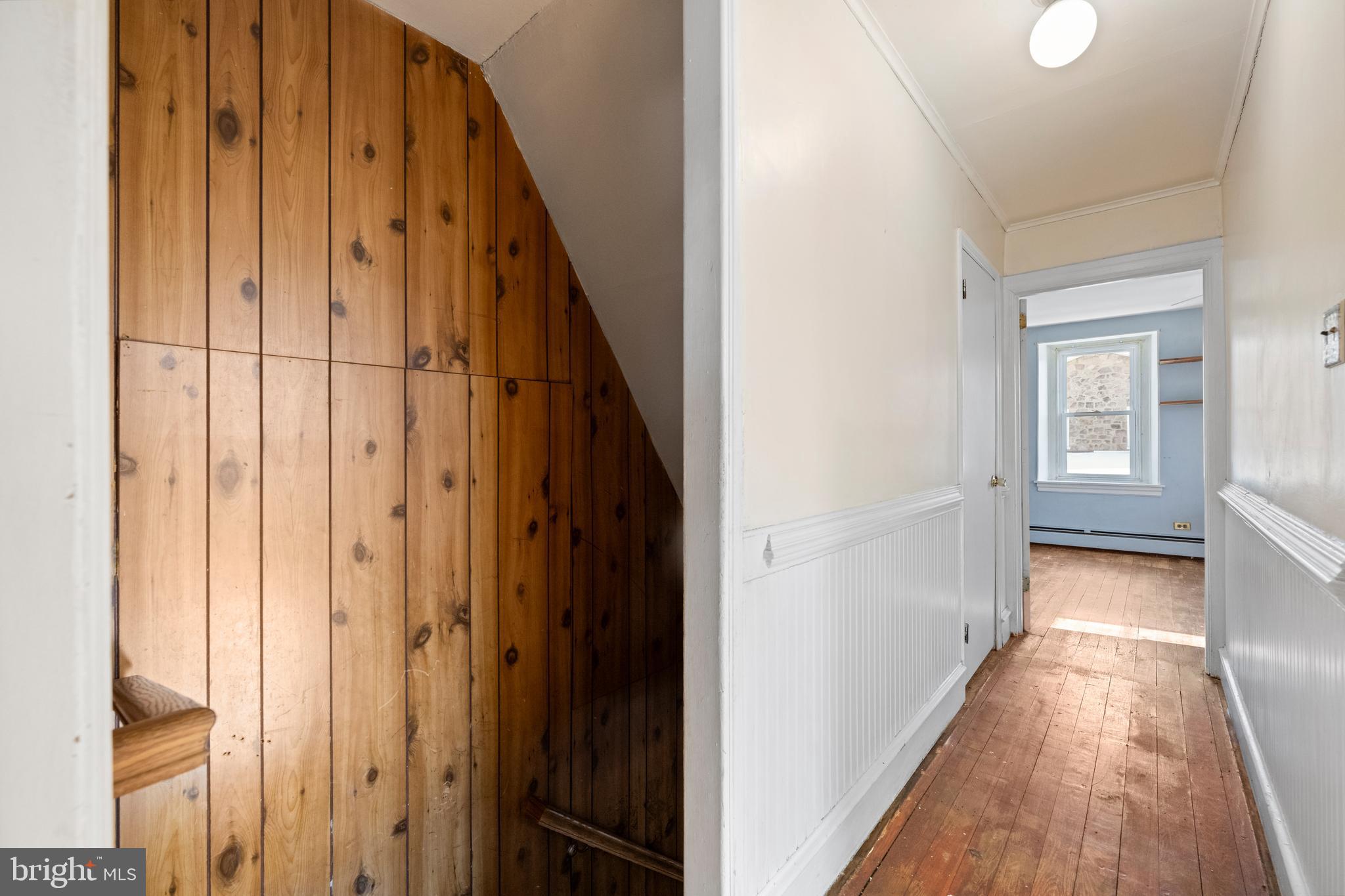 458 Renfrew Avenue Ambler, PA 19002 - Photo 22 of 31 a view of a hallway with wooden floor and staircase