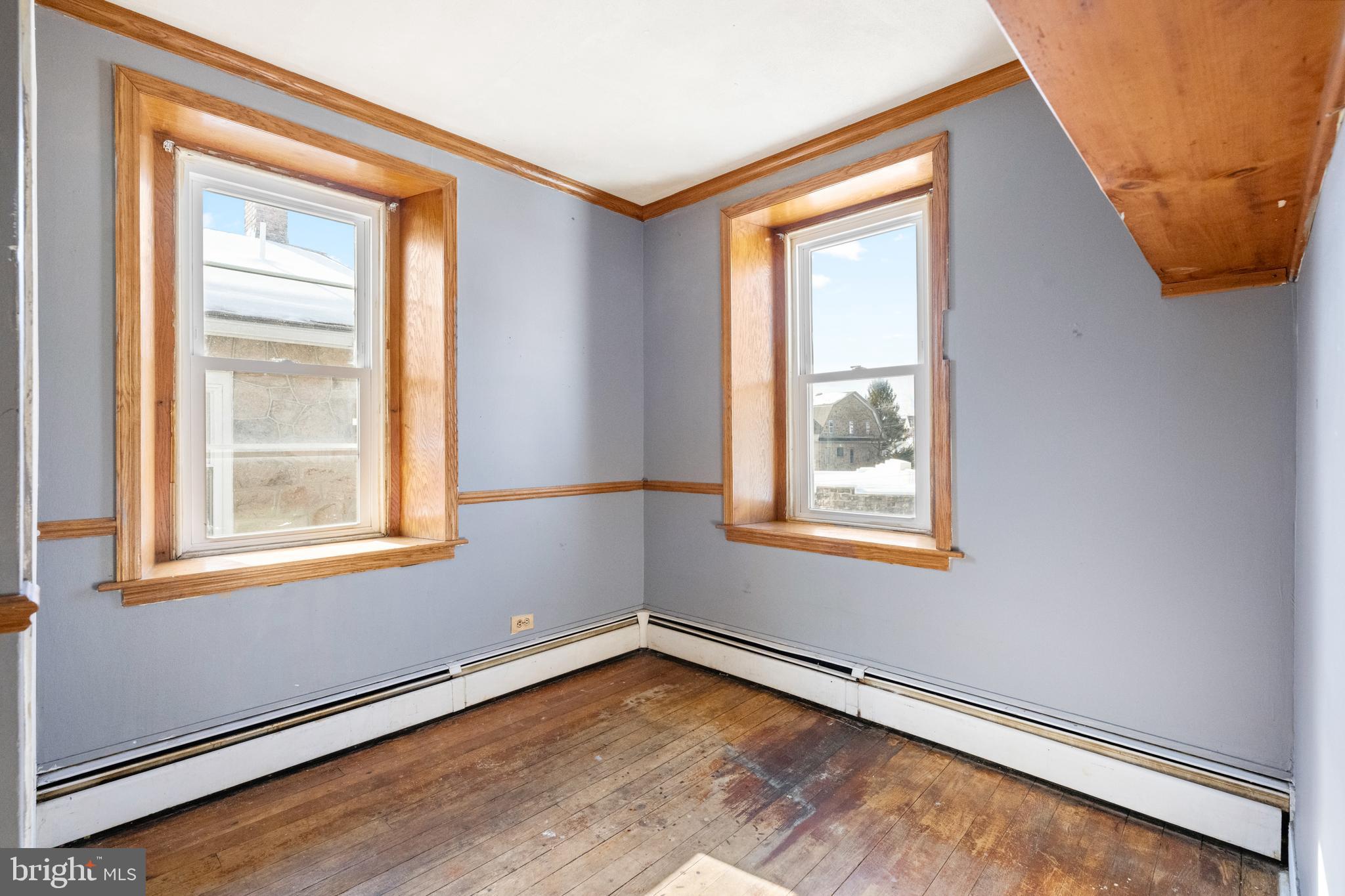 458 Renfrew Avenue Ambler, PA 19002 - Photo 23 of 31 a view of an empty room with wooden floor and a window