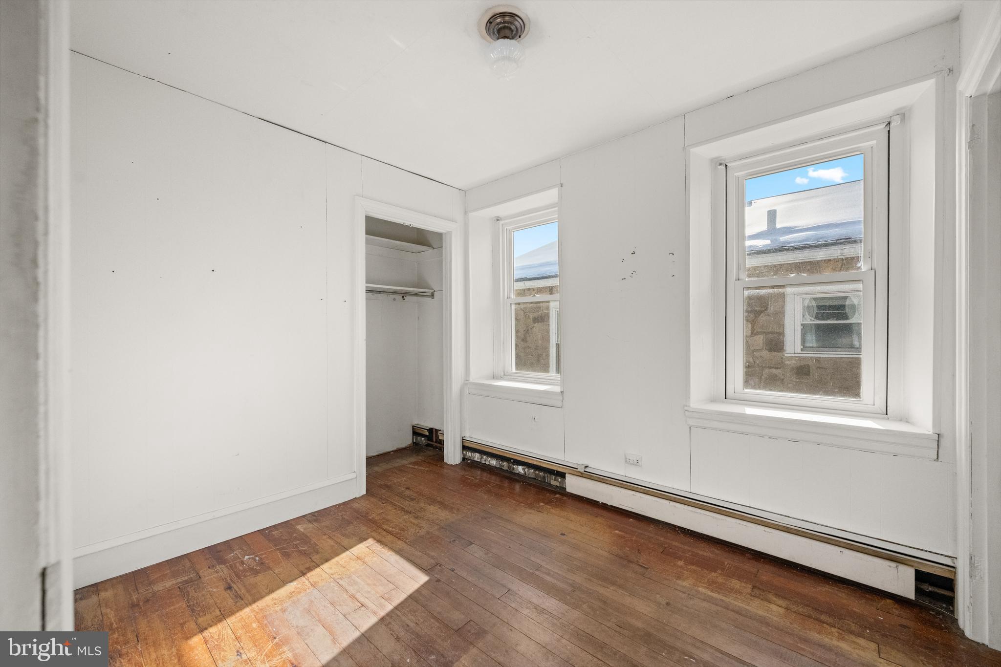458 Renfrew Avenue Ambler, PA 19002 - Photo 24 of 31 an empty room with wooden floor and windows