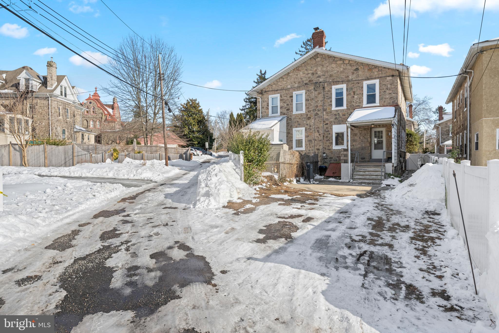 458 Renfrew Avenue Ambler, PA 19002 - Photo 6 of 31 a view of a house with a yard covered in snow