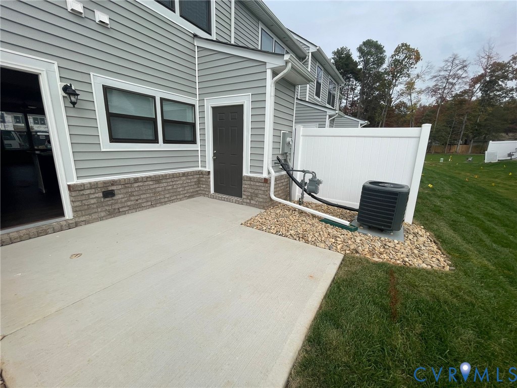 12201 Lightning Bug Loop Midlothian, VA 23112 - Photo 10 of 11 Concrete patio with direct outdoor access, featuri