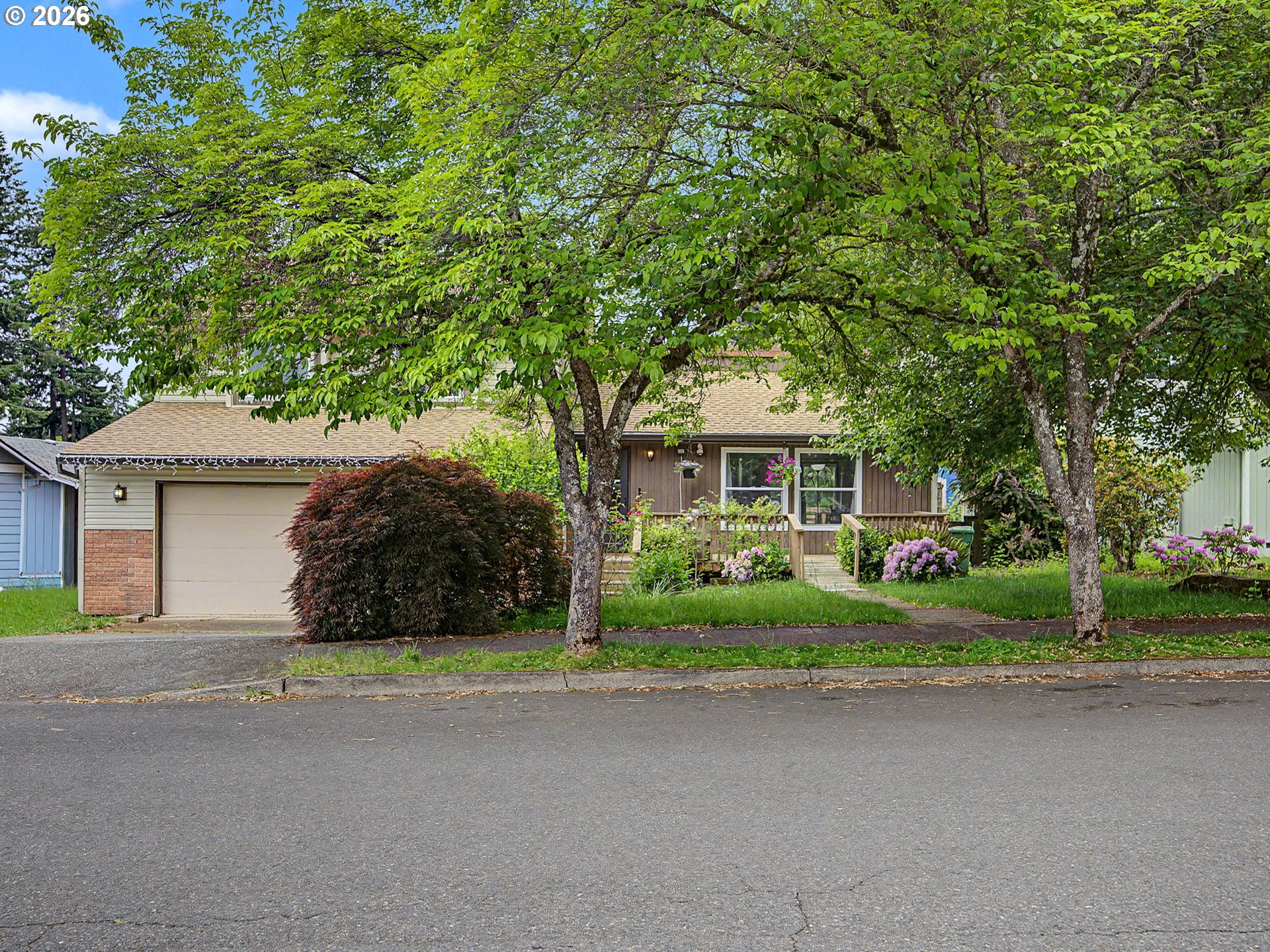 a front view of house with yard and green space