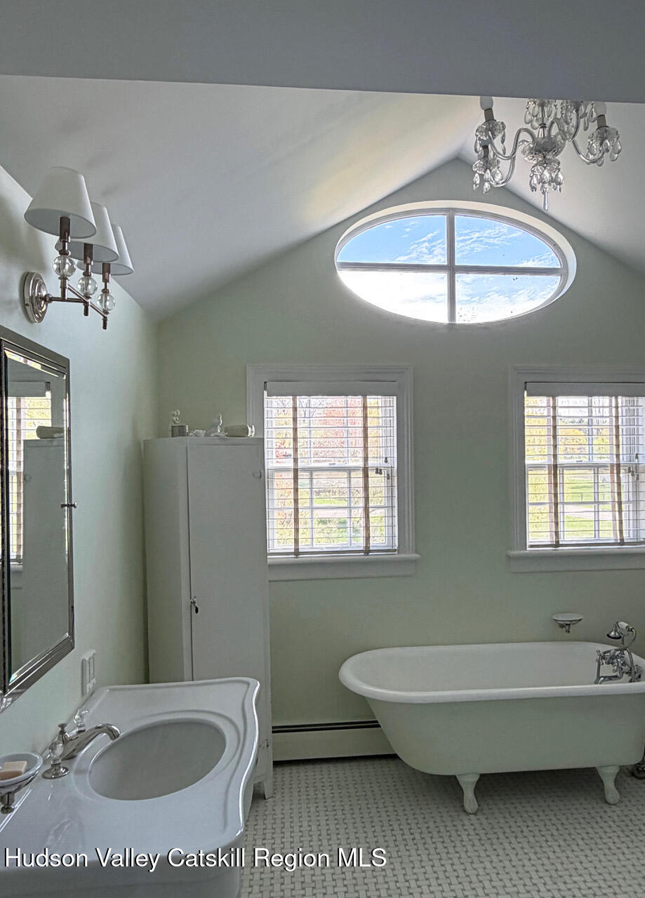 84 Sickler Road Lake Hill, NY 12448 - Photo 17 of 24 a bathroom with a sink and a mirror