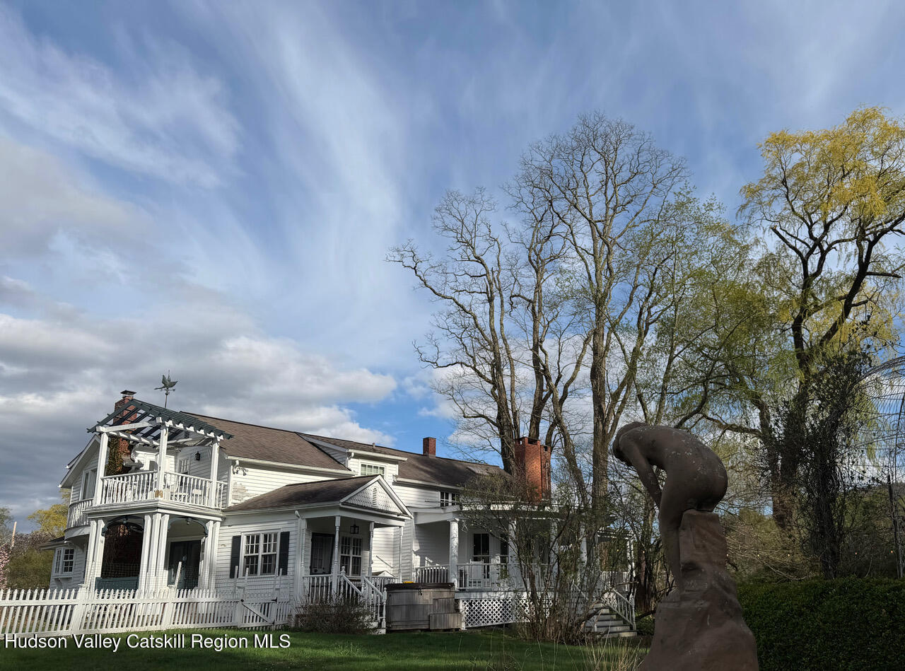 84 Sickler Road Lake Hill, NY 12448 - Photo 24 of 24 a front view of a house with garden and trees