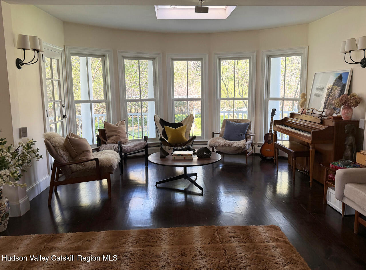 84 Sickler Road Lake Hill, NY 12448 - Photo 5 of 24 a living room with furniture wooden floor and a large window