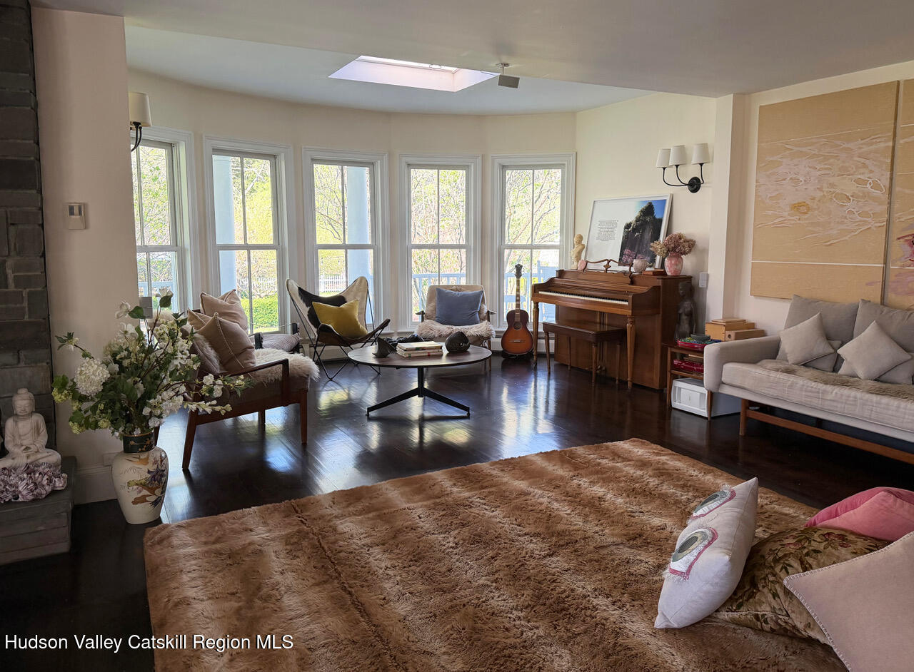 84 Sickler Road Lake Hill, NY 12448 - Photo 6 of 24 a living room with furniture or couch and a potted plant