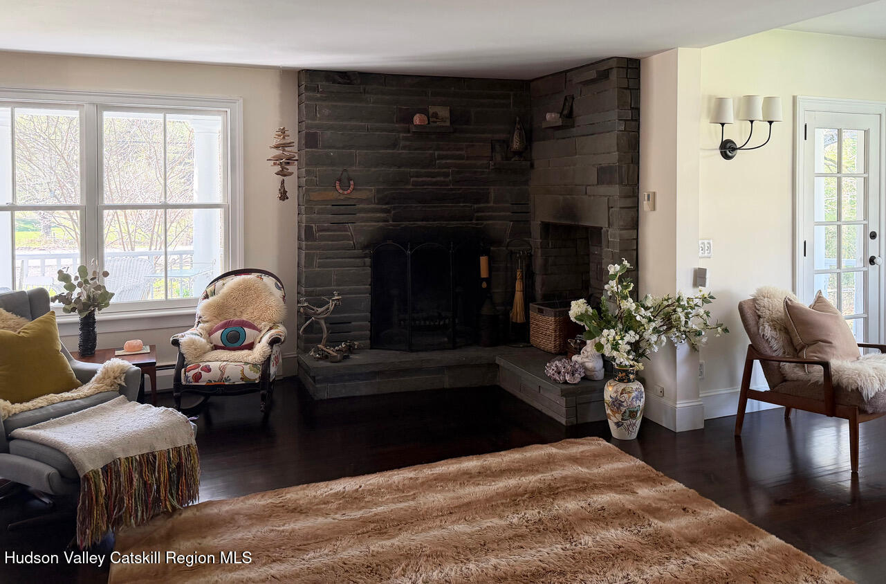 84 Sickler Road Lake Hill, NY 12448 - Photo 7 of 24 a living room with furniture and a fireplace