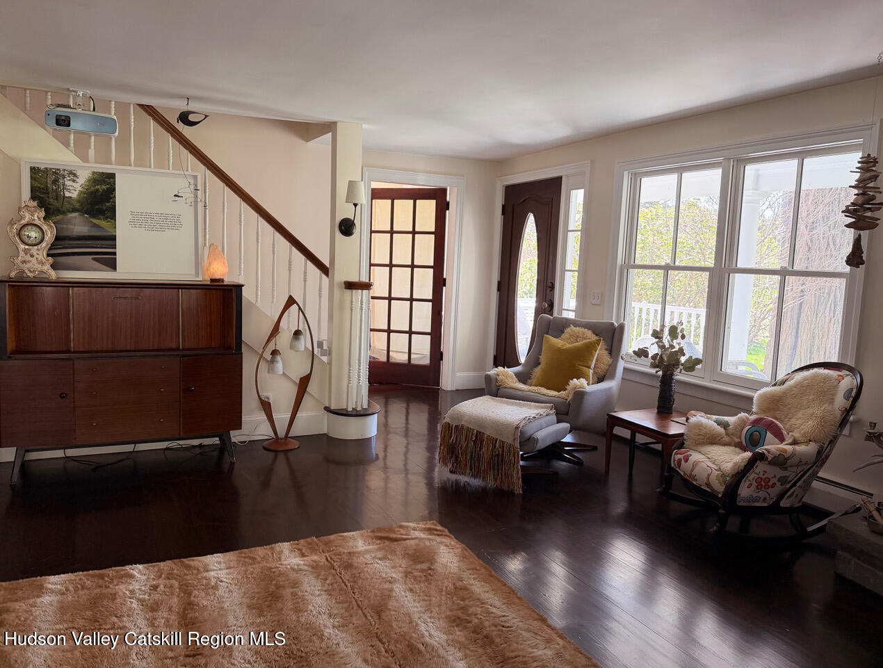 84 Sickler Road Lake Hill, NY 12448 - Photo 8 of 24 a living room with furniture a large window and wooden floor