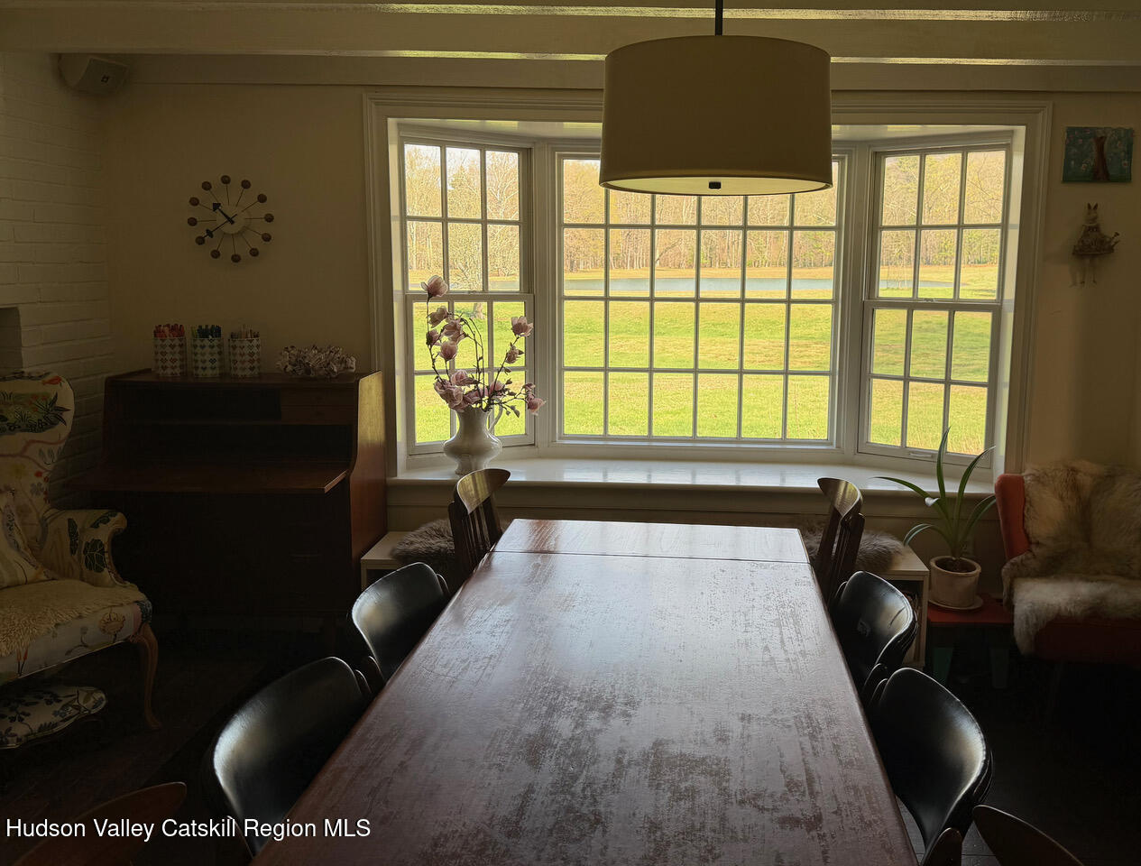 84 Sickler Road Lake Hill, NY 12448 - Photo 10 of 24 a living room with furniture and a floor to ceiling window