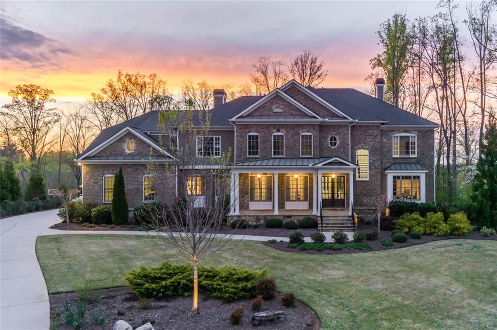 702 Cogdell Ridge Milton, GA 30004 - Photo 1 of 1 a front view of a house with garden