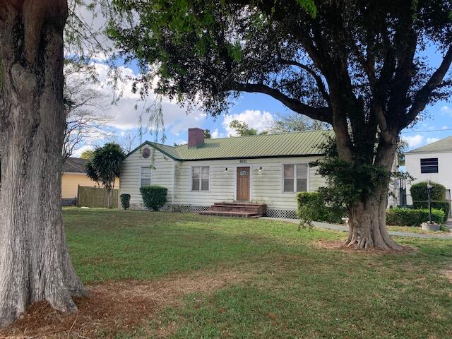 1631 Bacom Point Road Pahokee, FL 33476 - Photo 1 of 19 a view of a house with a yard