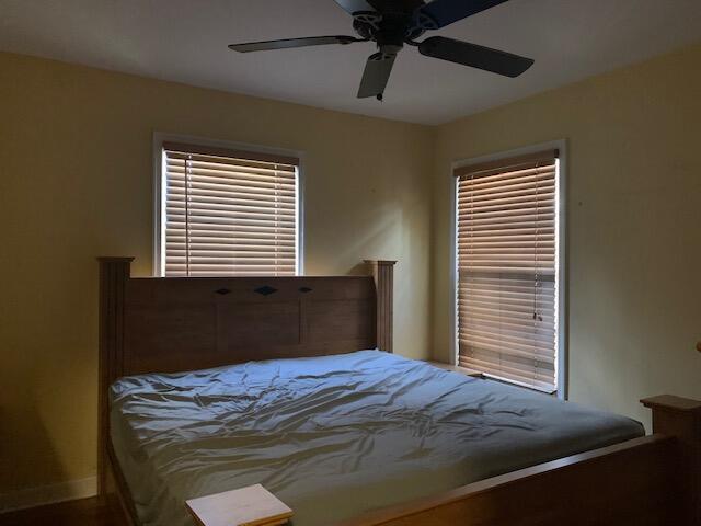 1631 Bacom Point Road Pahokee, FL 33476 - Photo 15 of 19 a bedroom with a bed and a window