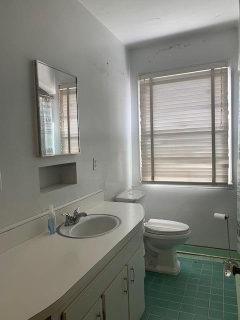 1631 Bacom Point Road Pahokee, FL 33476 - Photo 17 of 19 a bathroom with a sink and a toilet
