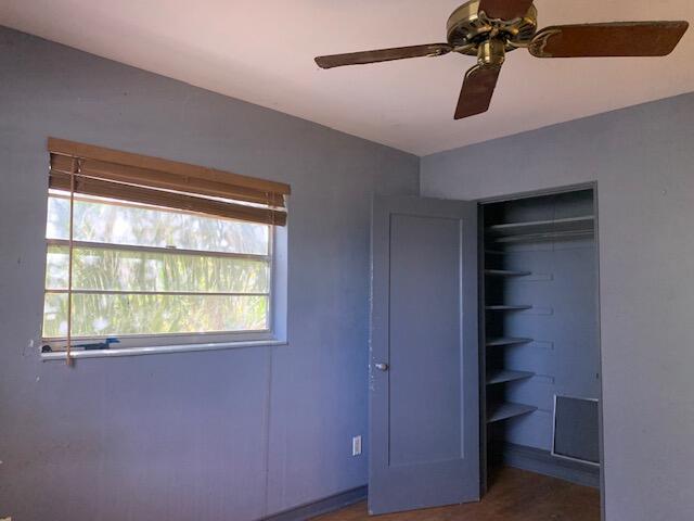 1631 Bacom Point Road Pahokee, FL 33476 - Photo 9 of 19 a view of a room with a ceiling fan and a window