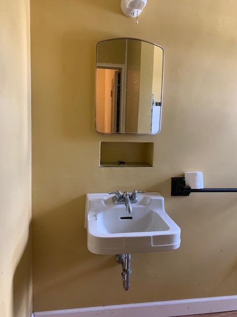 1631 Bacom Point Road Pahokee, FL 33476 - Photo 10 of 19 a bathroom with a sink and a mirror