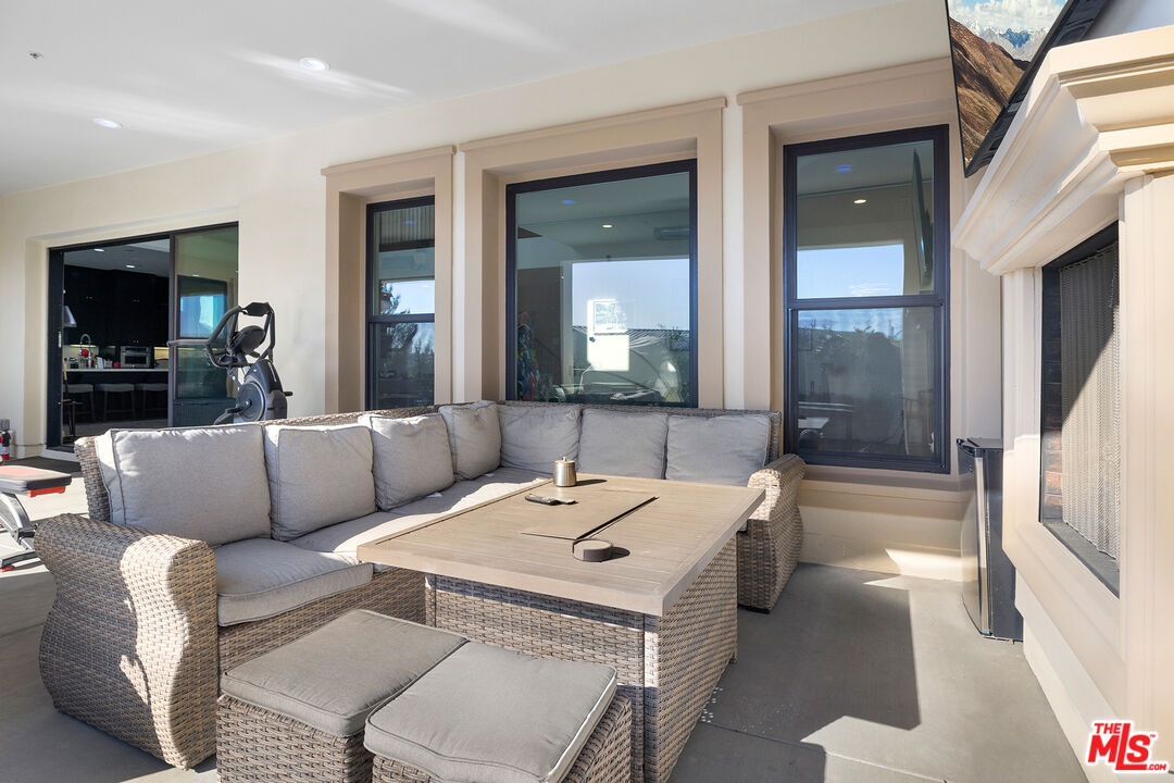 20234 Jubilee Way Porter Ranch, CA 91326 - Photo 15 of 30 a living room with furniture and a large window