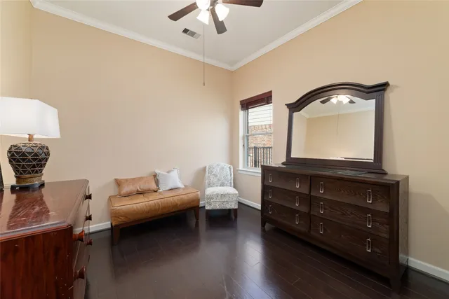 a living room with furniture and a mirror