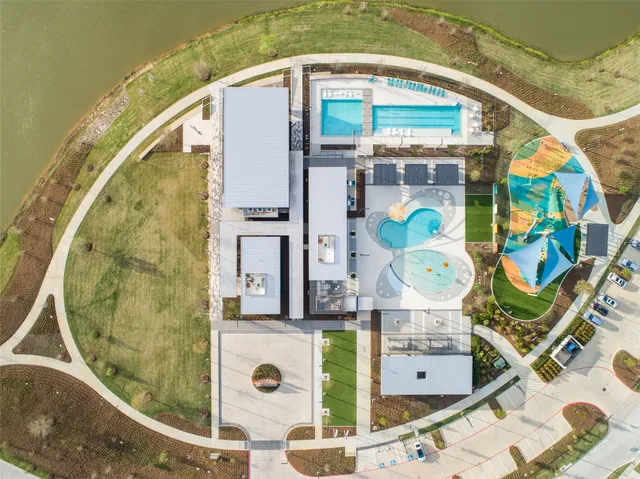 an aerial view of a house with a swimming pool