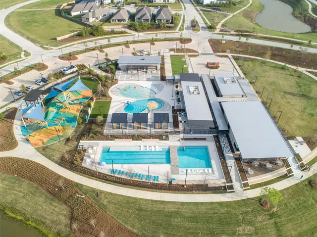 a view of swimming pool with outdoor seating