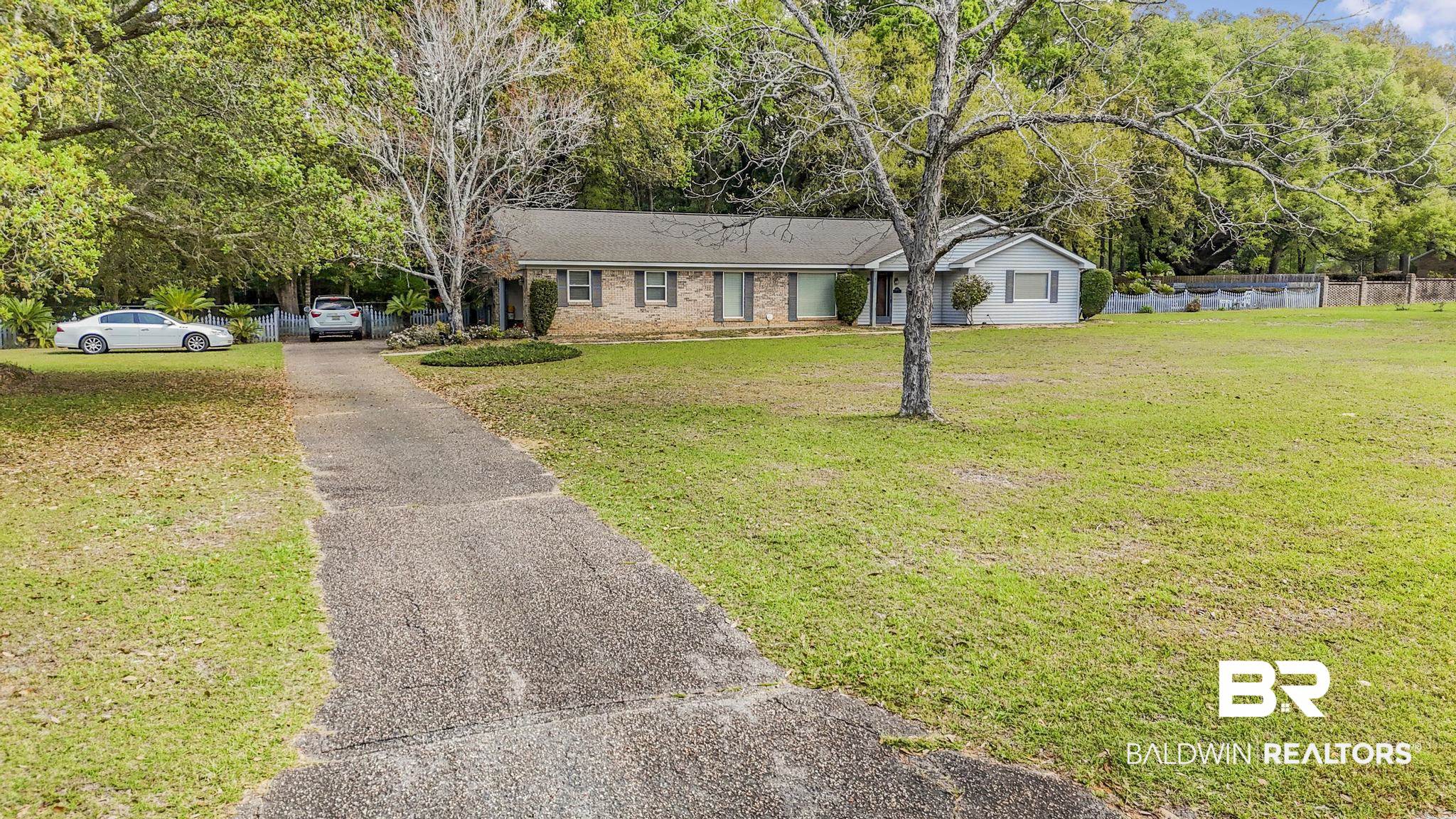 10207 Plantation Drive Daphne, AL 36526 - Photo 7 of 48 Ranch-style home with brick siding and asphalt driveway