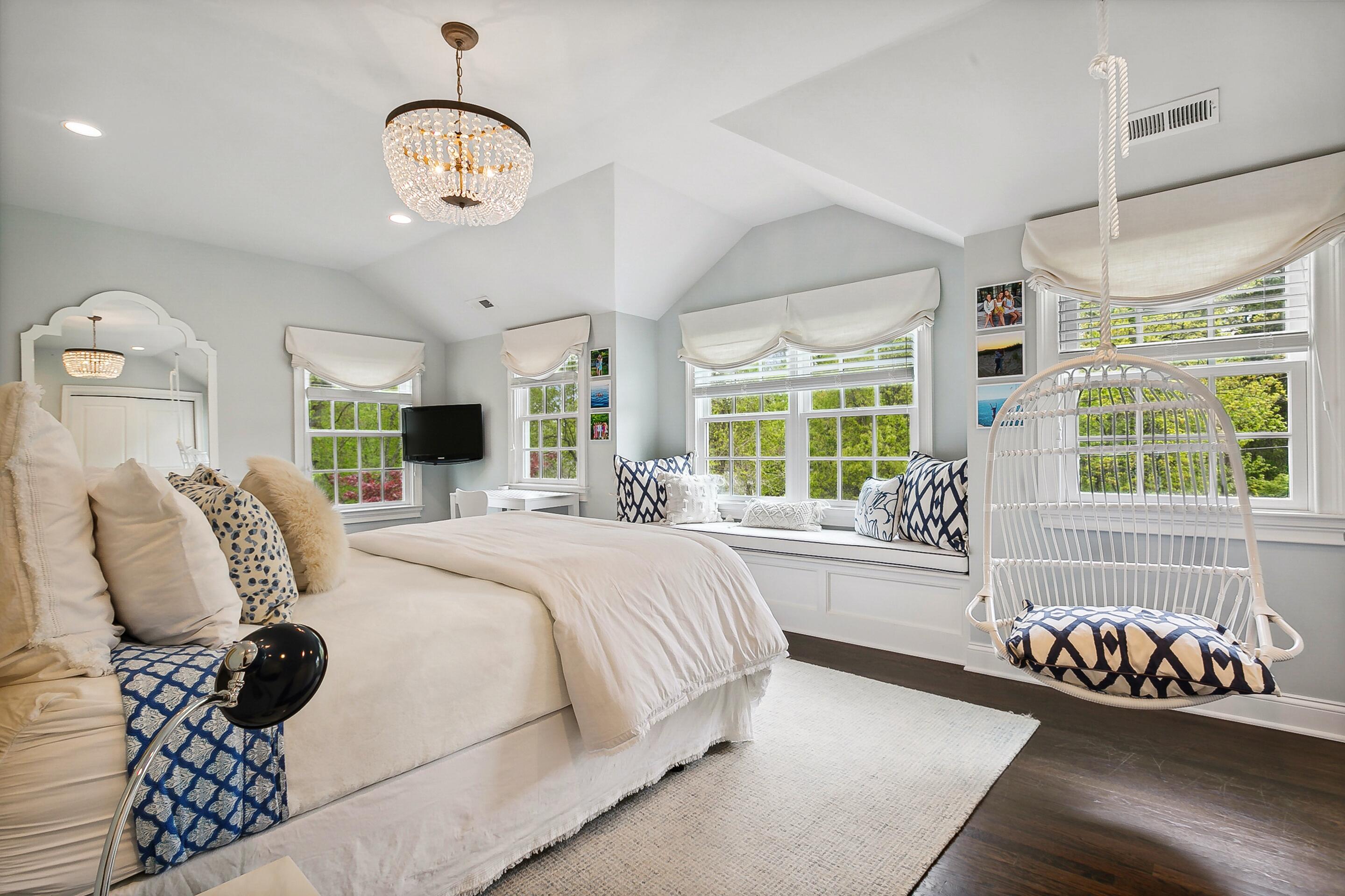 64 Summit Ridge Road New Canaan, CT 06840 - Photo 19 of 39 a spacious bedroom with a bed and a large window