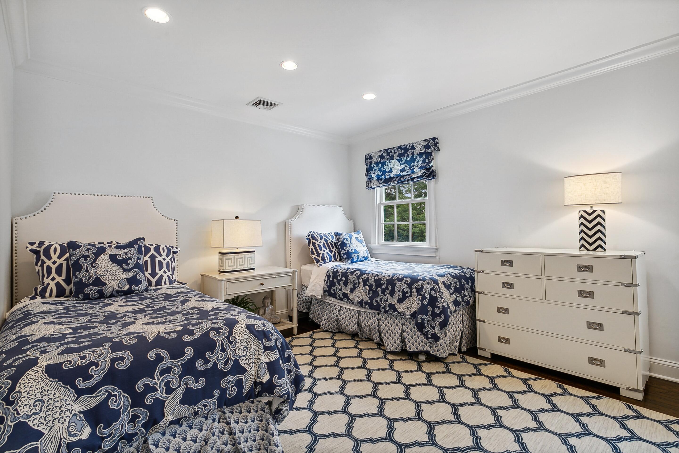 64 Summit Ridge Road New Canaan, CT 06840 - Photo 21 of 39 a bedroom with two beds and a window